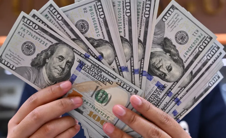 Dollar marks first monthly gain since October 